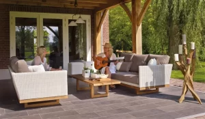 Woman playing guitar and enjoying her outdoor porch